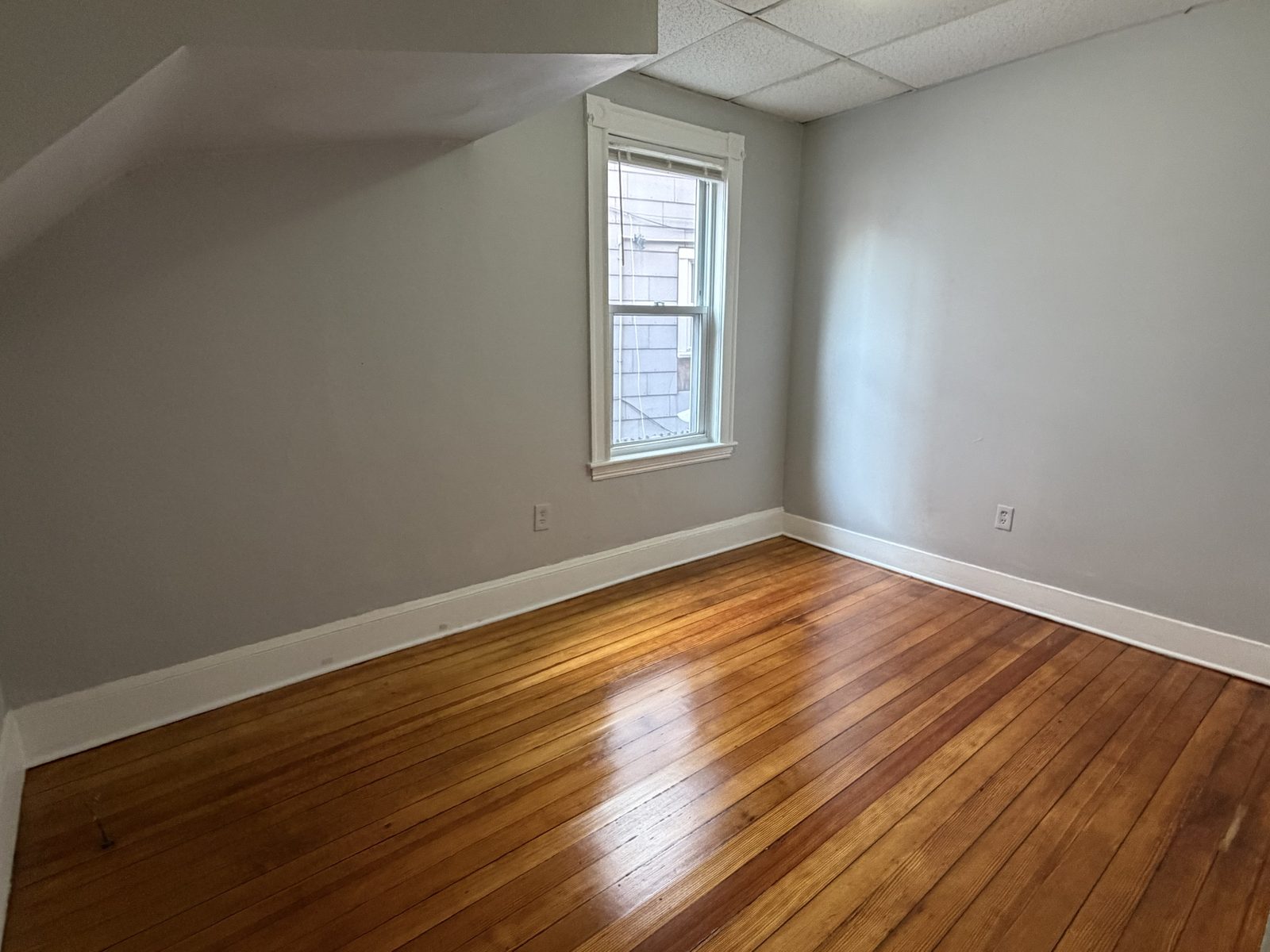 Bedroom with sloped ceiling