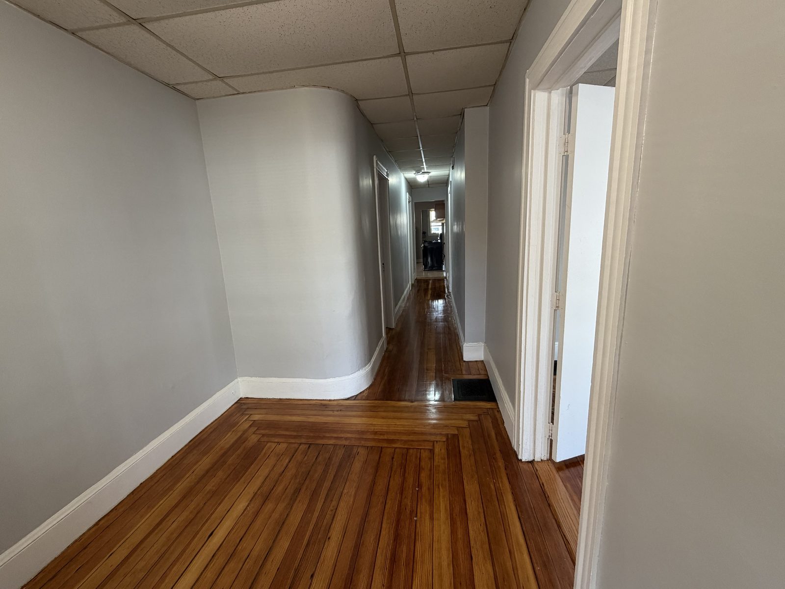 Hallway with inlaid hardwood floors